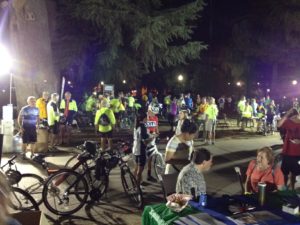 A crowd of cyclists and other participants gather in front of the Capitol before the ride begins.