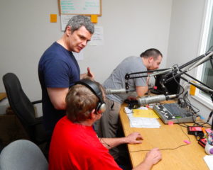 Society for the Blind and Reading Service of the Redwoods staff work together in the Arcata recording booth.