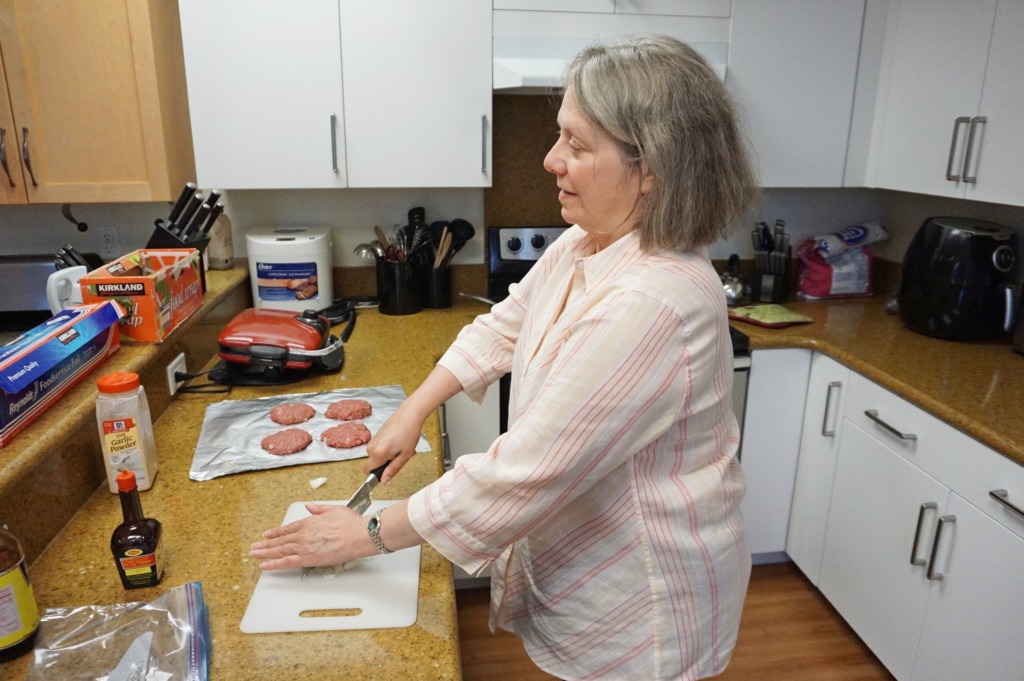 Photo of Susan Hood making a meal in the teaching kitchen at Society for the Blind