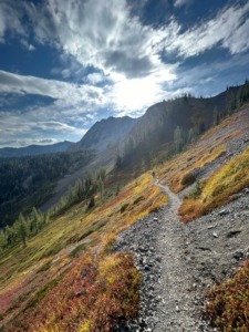 Landscape photo for a trail that leads up to the mountain range and sky